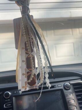 football with crosses car tassel